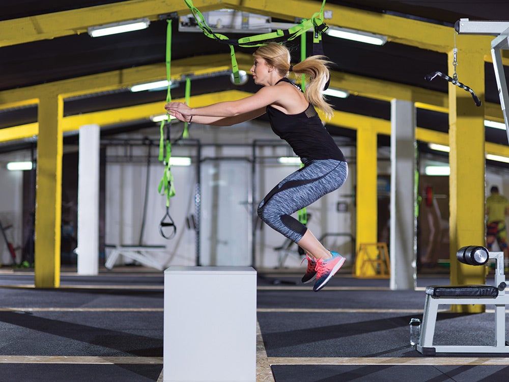 Jumping-on-Box-Oxygen Woman Performing Box jumps