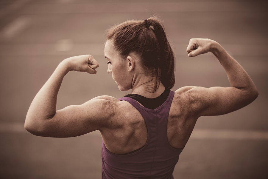 Traps Woman with strong back muscles