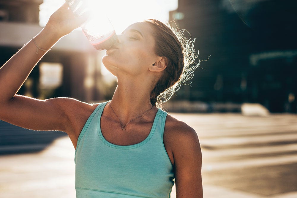 Drinking-Water fit woman drinking water fat loss
