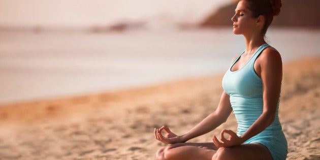 meditation 630 Woman meditating on the beach
