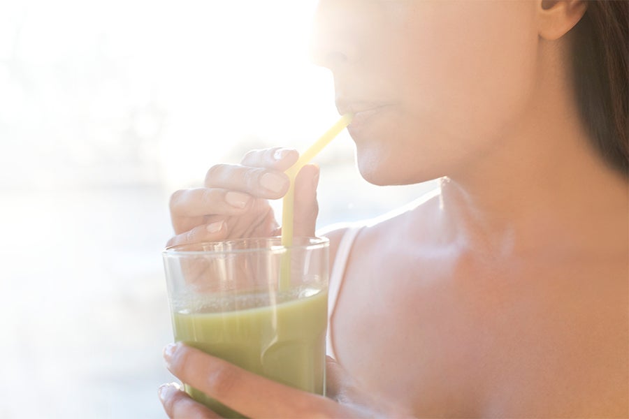 Nutrition Image The Skinny on Getting Lean Woman drinking green juice