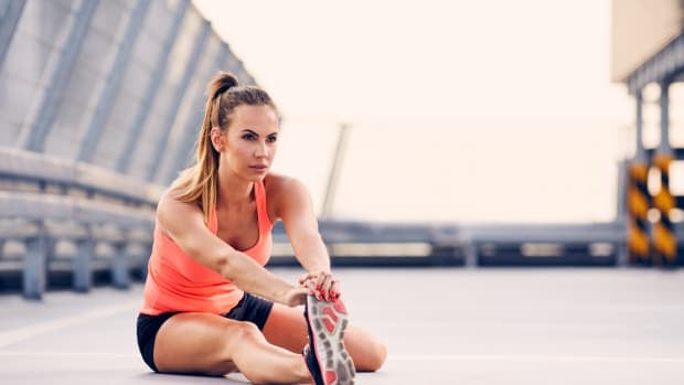 fit woman stretching