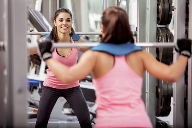Happy girl doing some squats
