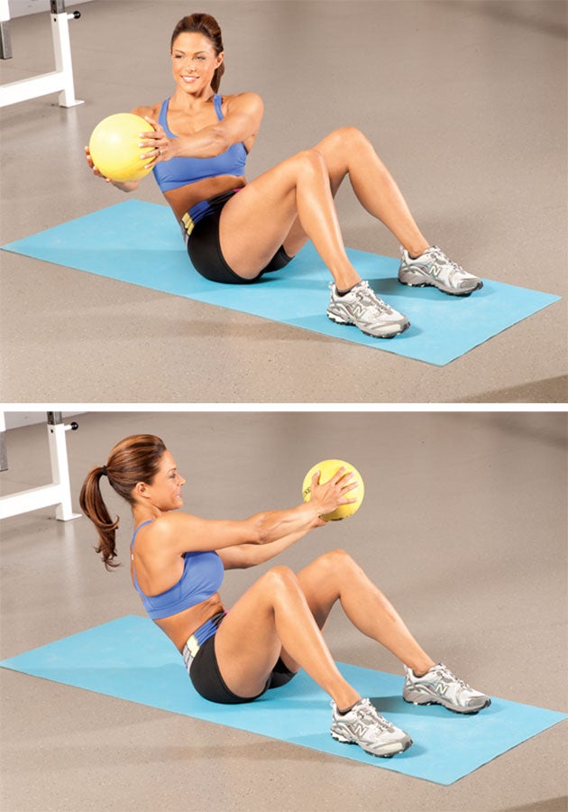 Medicine-Ball-Rotation woman demonstrating a medicine ball rotation on the ground
