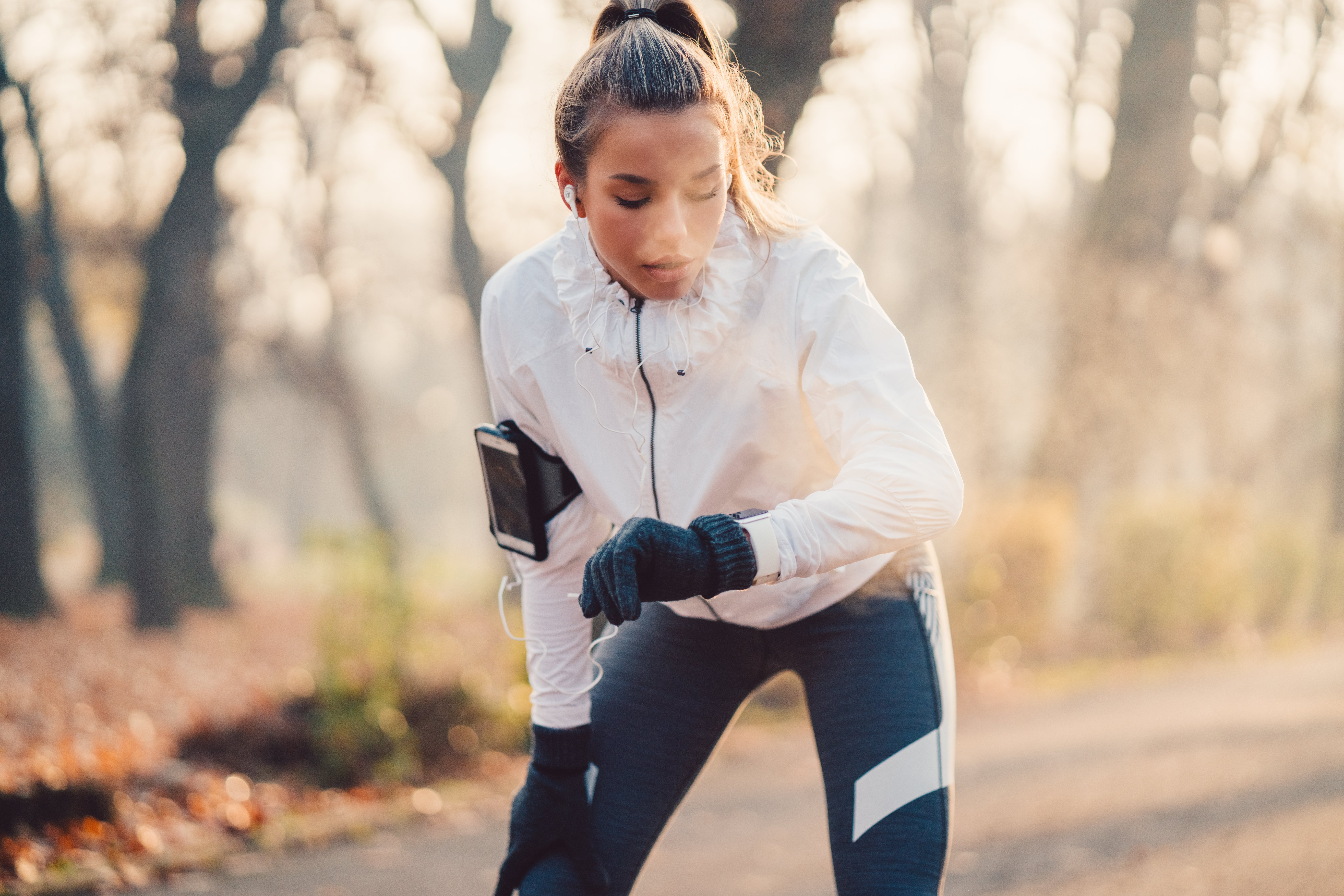 Teenage girl checking heart rate on smartwatch
