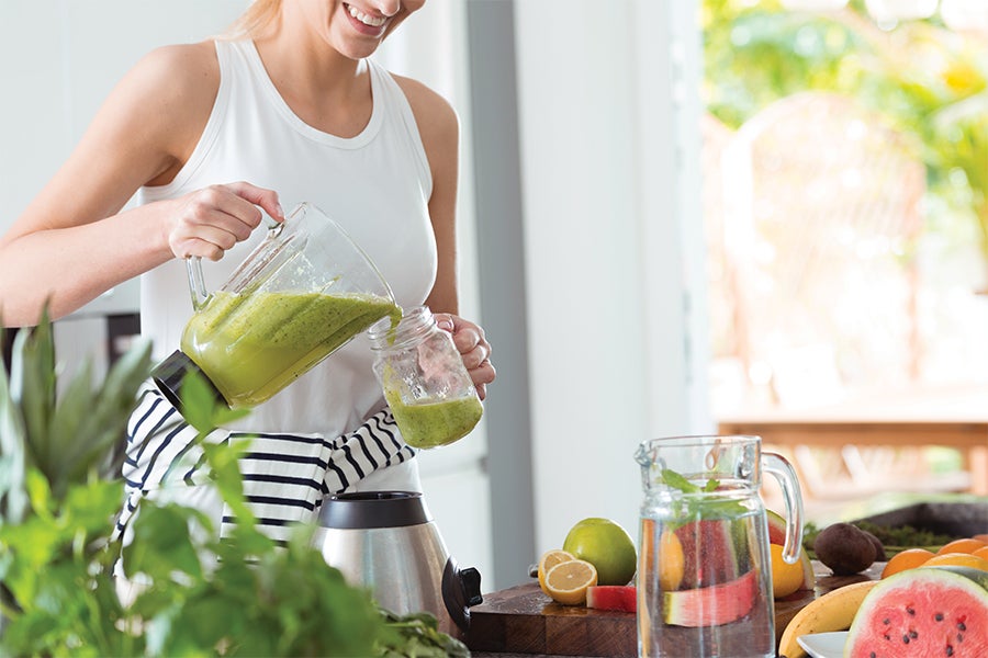 Woman pouring a smoothie