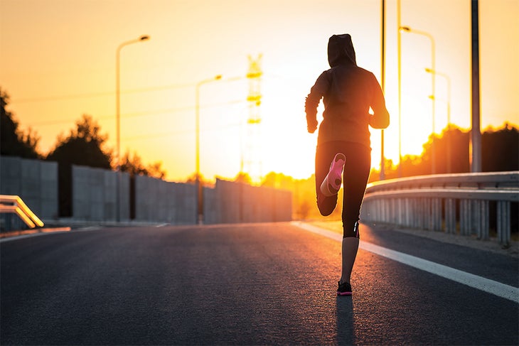 Workout Morning or Night Woman running as the sun rises