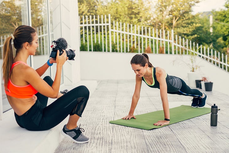 Infleuncers Filming female fitness influencers filming workouts