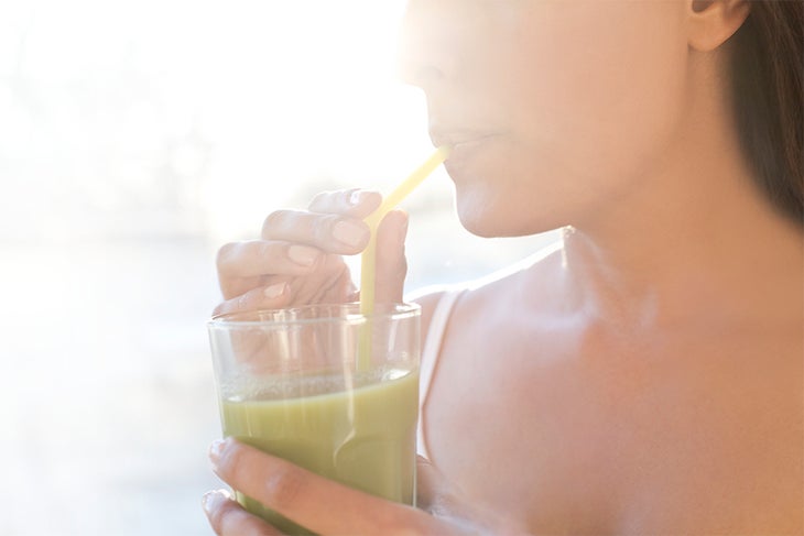 Nutrition Image The Skinny on Getting Lean Woman drinking green juice
