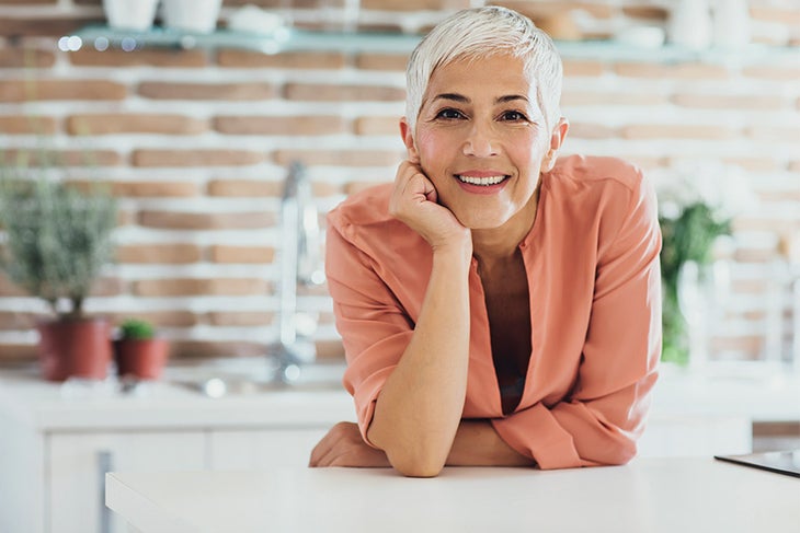 50s and Beyond Healthy older woman in the kitchen smiling