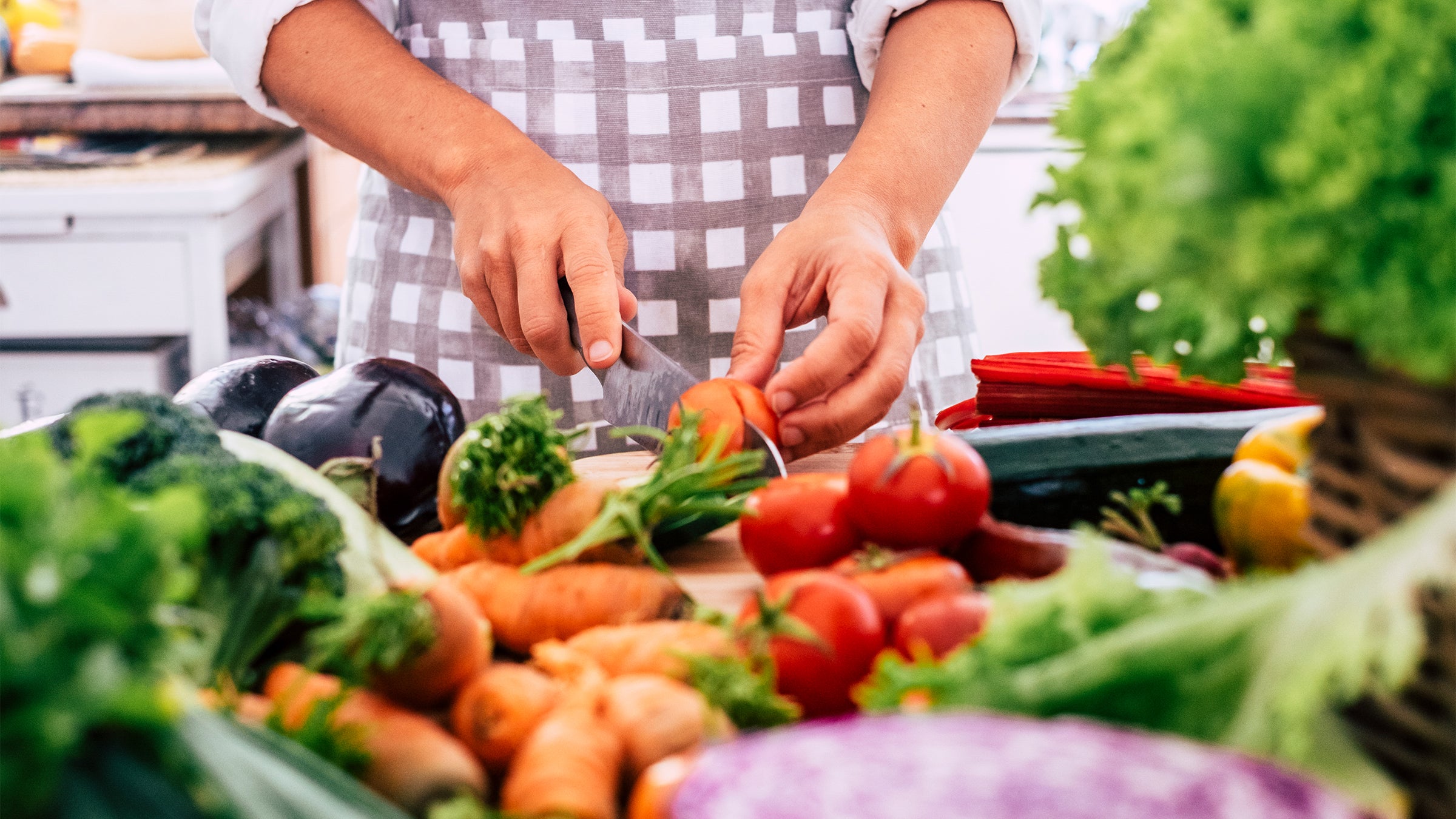 Woman cutting vegetables in the kitchen