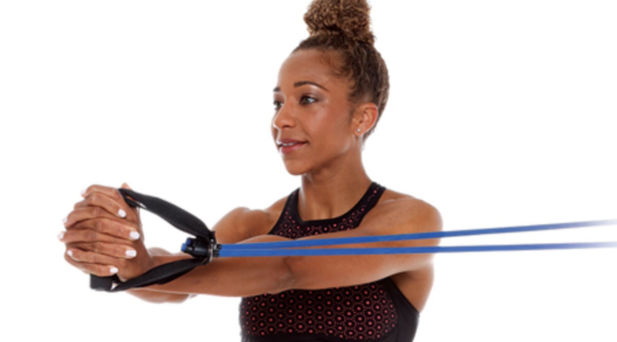 Woman using resistance band
