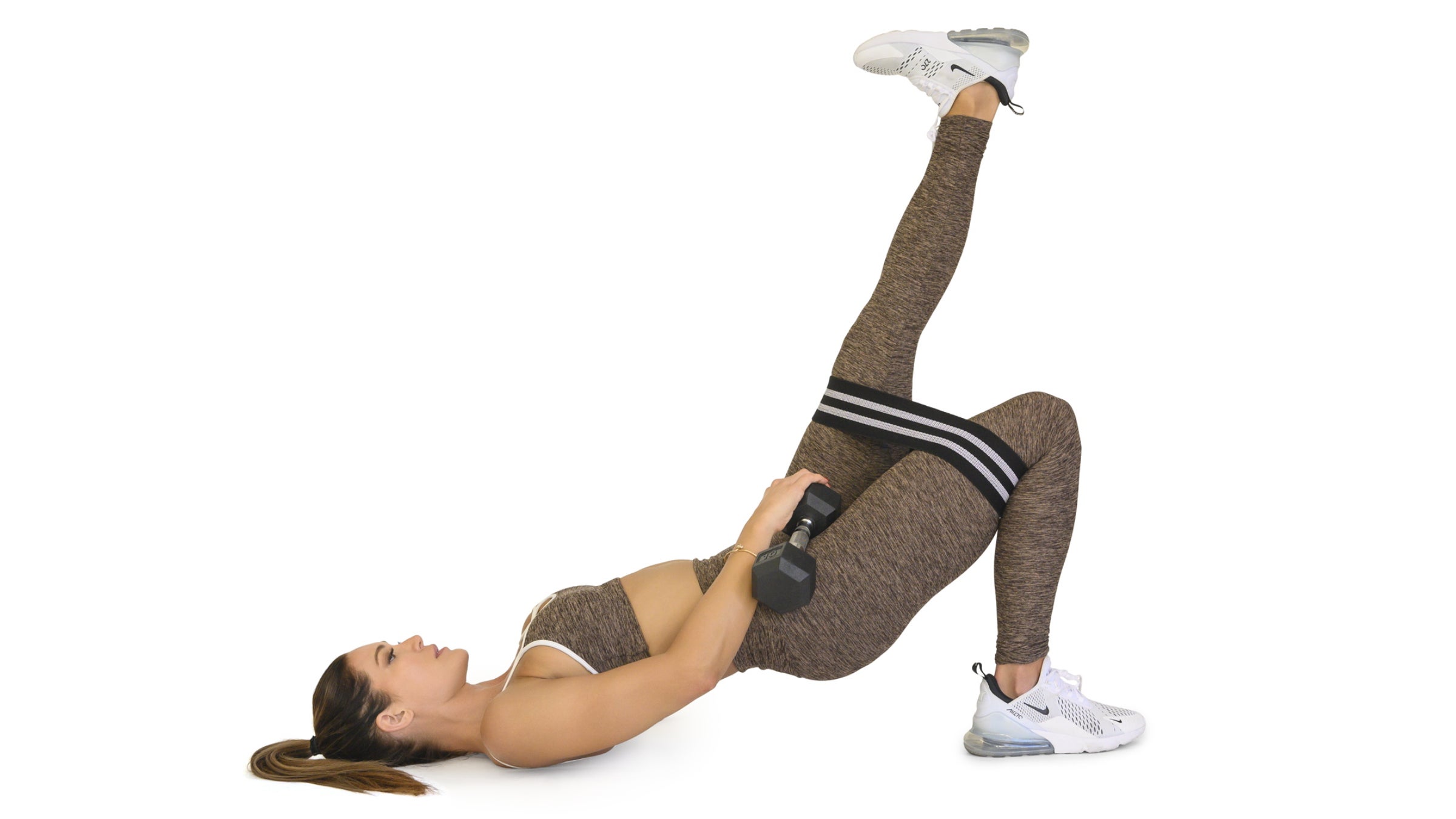 Woman holding a single-leg glute bridge