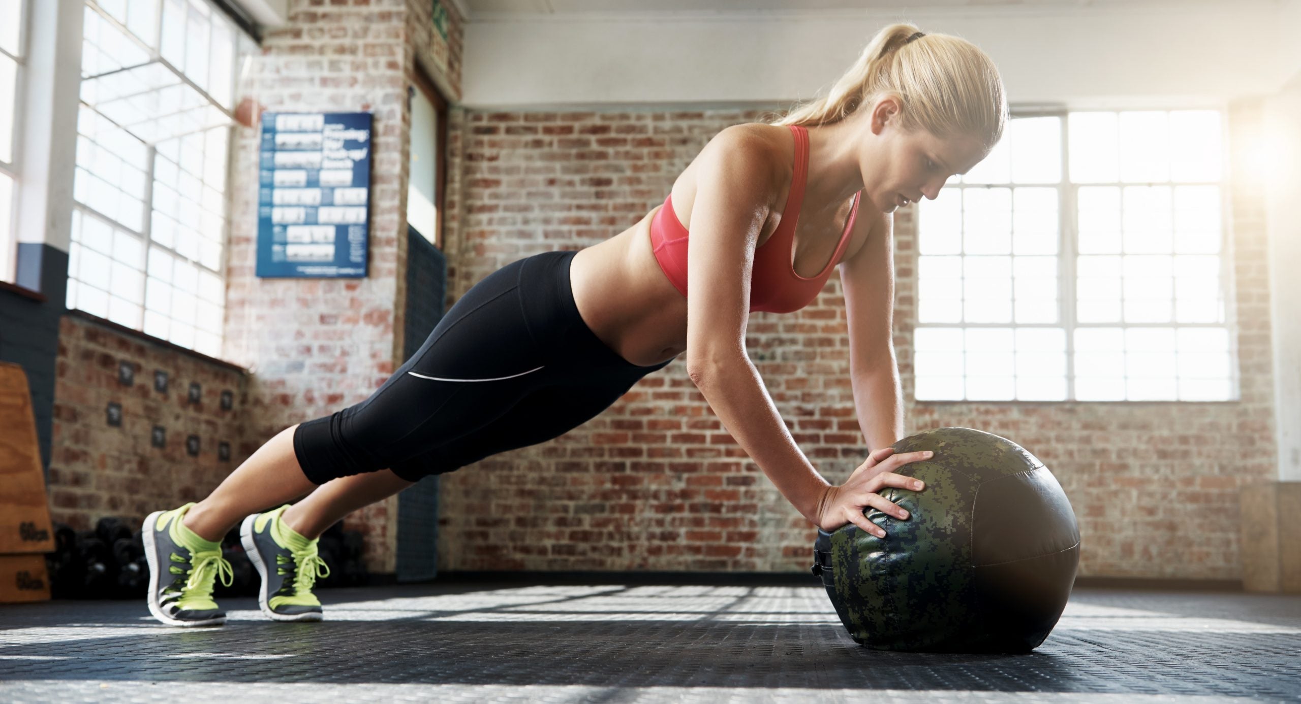 Woman Doing Medicine-Ball Push-Ups